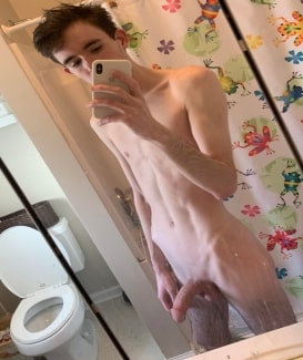 Nude boy taking selfies