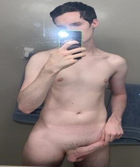 Nude guy holding his dick