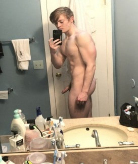 Nude boy taking a mirror selfie